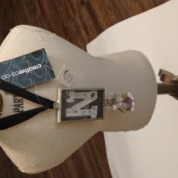 Hanging capital N crystal charm with a black satin tie - Picture 1 of 5